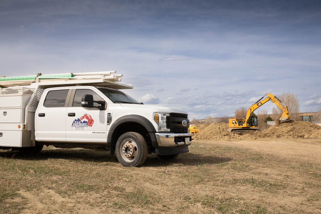 TLC Patriot service truck and excavator on a job site
