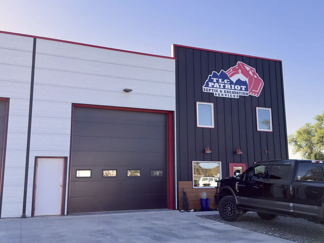 TLC Patriot's building with company signage and garage doors